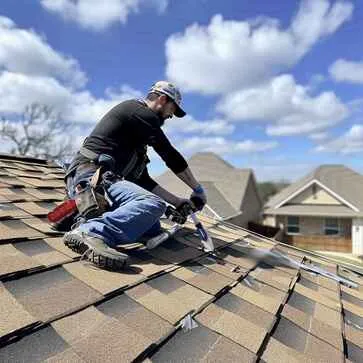 Shingle Masters roofer doing shingle roof inspection